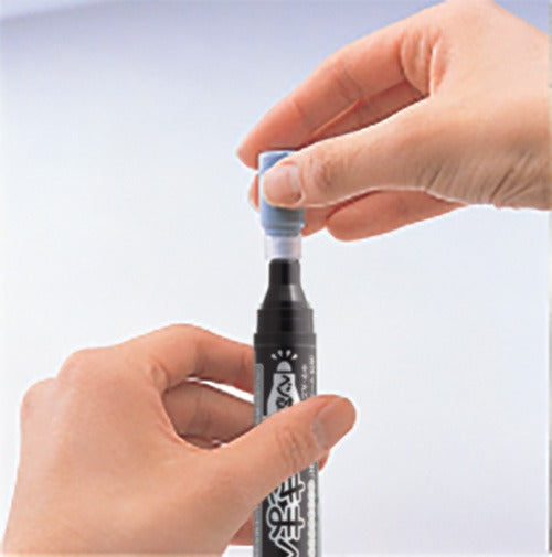 Holding the ECO-GREEN refill ink container upright and cutting the tab