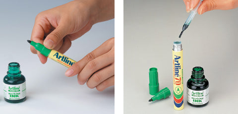Twisting off the nib holder and refilling an Artline permanent marker with a syringe