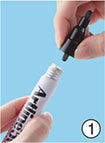 Twisting off the nib holder of an Artline whiteboard marker