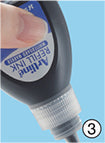 Squeezing the refill bottle to inject ink into the Artline whiteboard marker