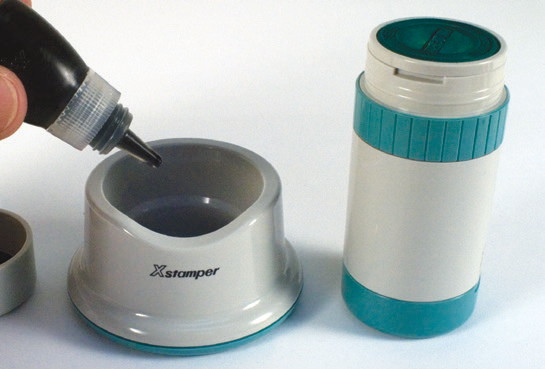 Adding refill ink to the base and travel cap of an Xstamper XpeDater